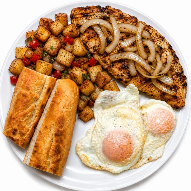 Grilled Chicken with 2 Eggs, Grits or Home Fries & Cuban Toast.