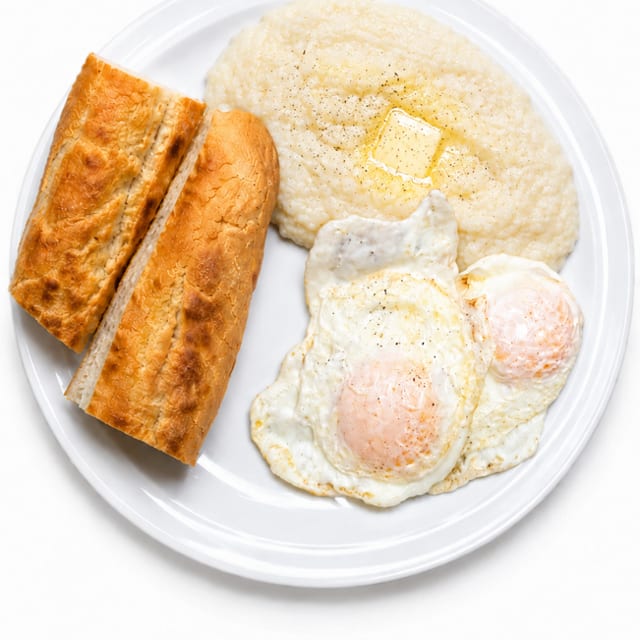 2 Eggs with Grits or Home Fries & Cuban Toast Platter.